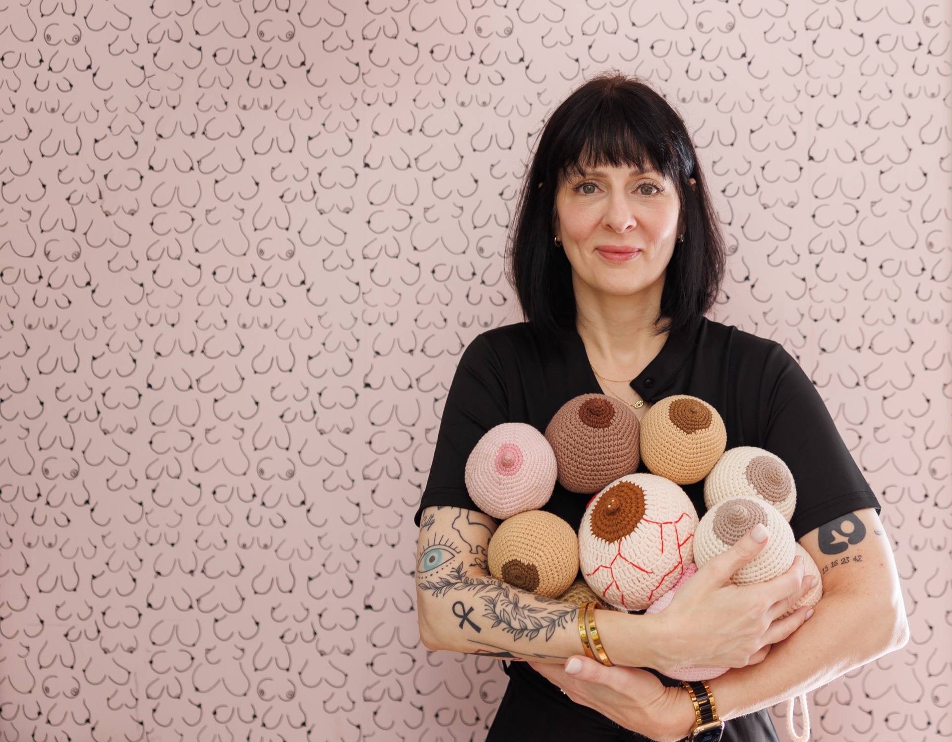 Margaret Salty holding crochet breast models